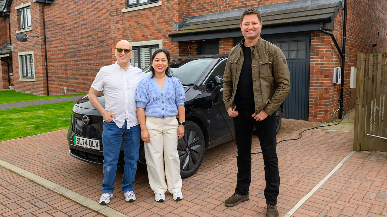 George stands outside the home of Carlo and Anggi in Winchburgh to talk about EV charging