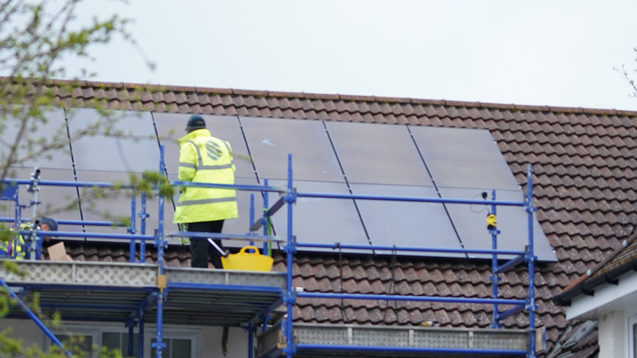 Solar panels being installed on a roof
