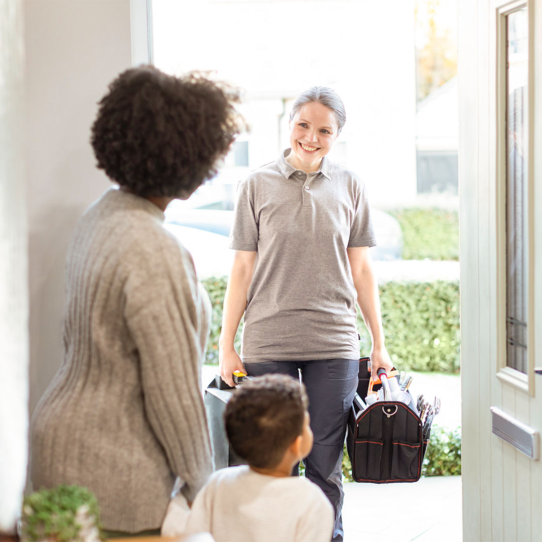 Qualified home heating engineer arriving at a customer’s property for boiler repair and maintenance, representing trusted home energy support, heating system care and reliable household comfort