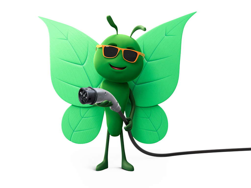 Bruce wearing sunglasses holding EV charger