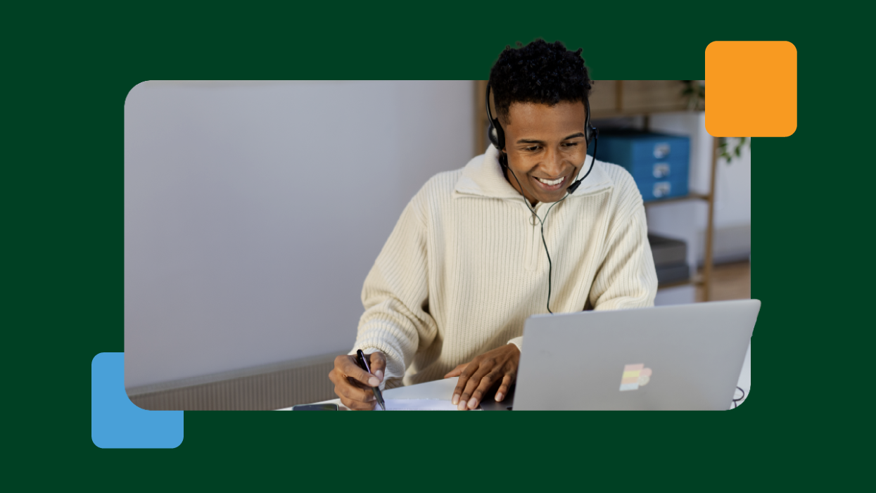 Business professional working remotely using a laptop and headset, demonstrating digital collaboration, customer support and flexible working solutions in a modern workplace.