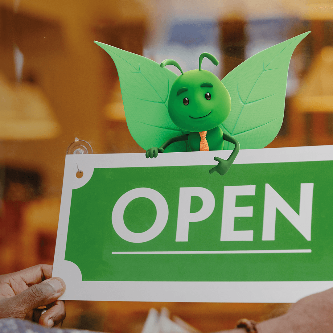 Bruce holding a open sign.