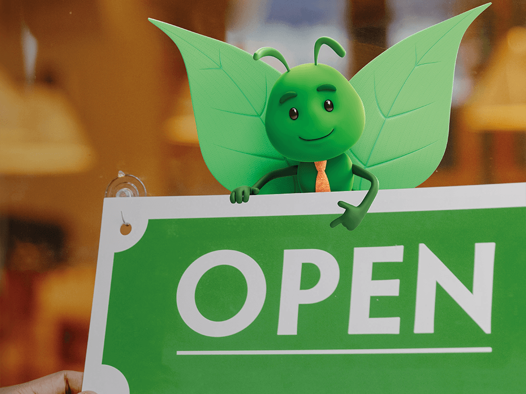 Bruce holding a open sign.