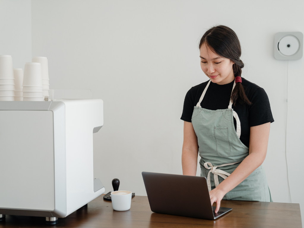 Lady in apron working online