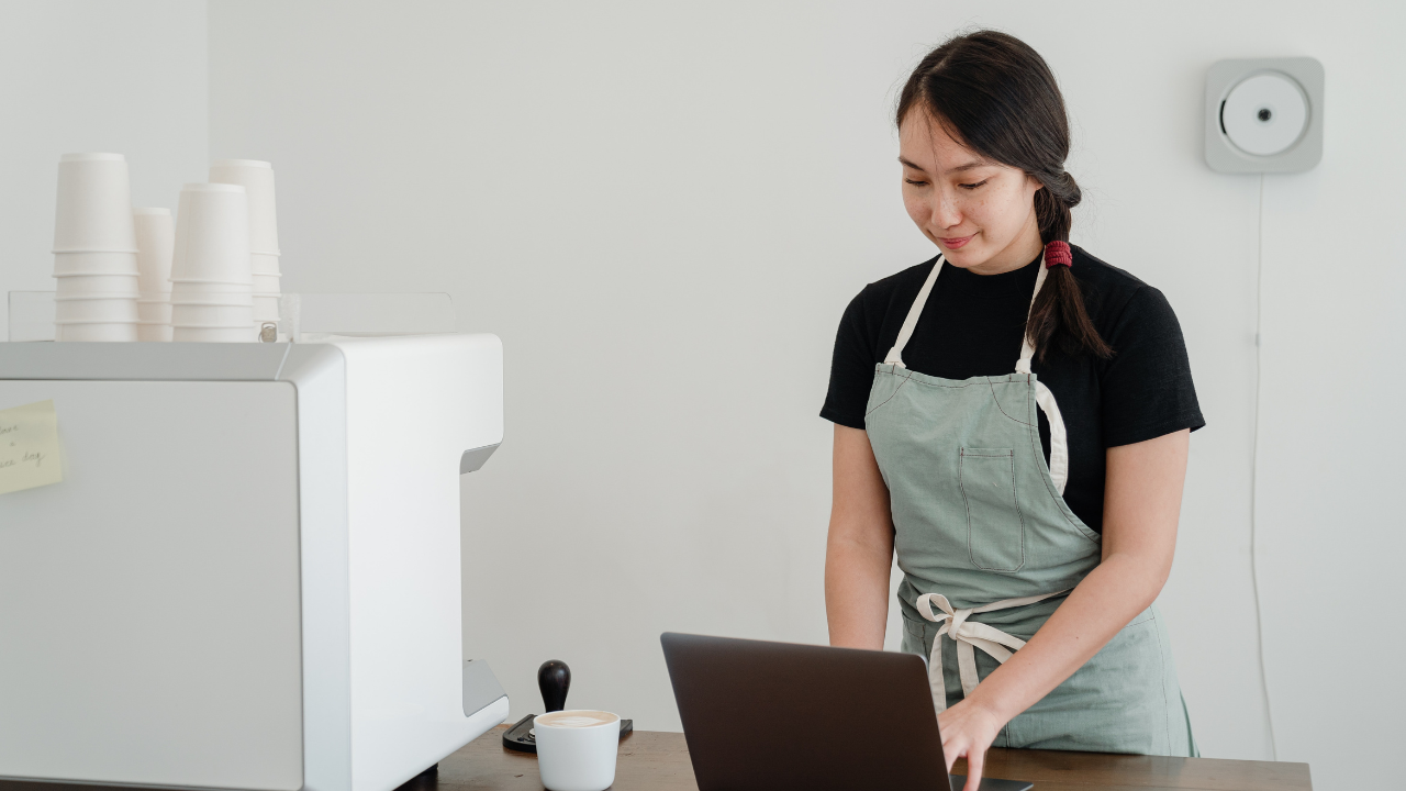 Lady in apron working online