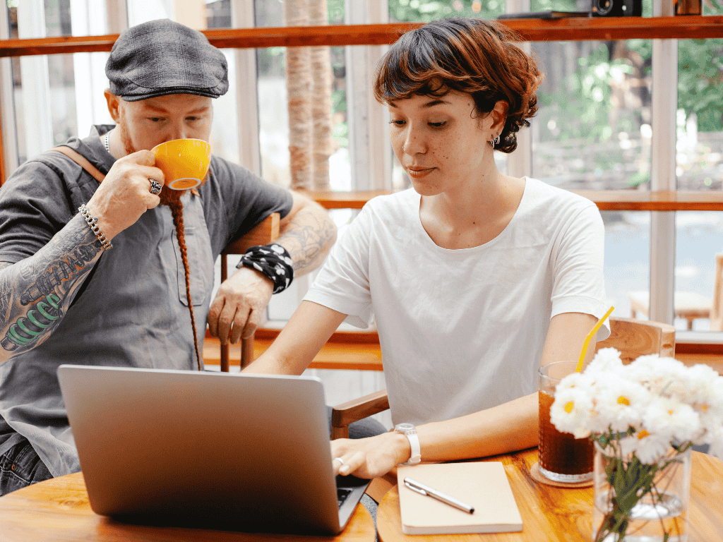Business professionals reviewing information on a laptop, exploring digital solutions and opportunities to support business growth.