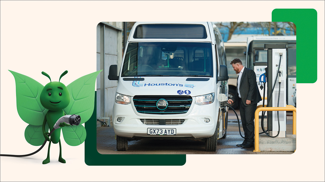man plugging EV charger in to a bus