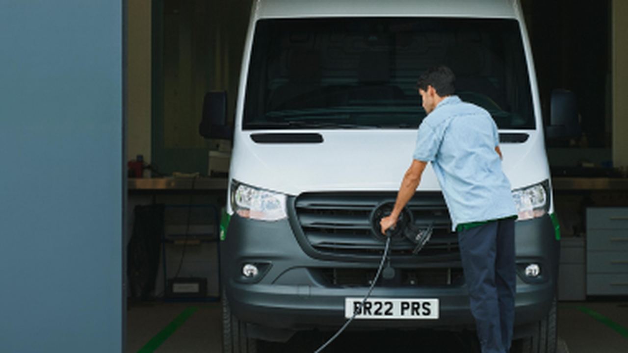 Man charging electric van
