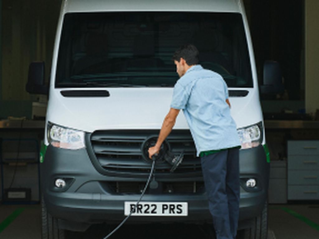 Man charging electric van