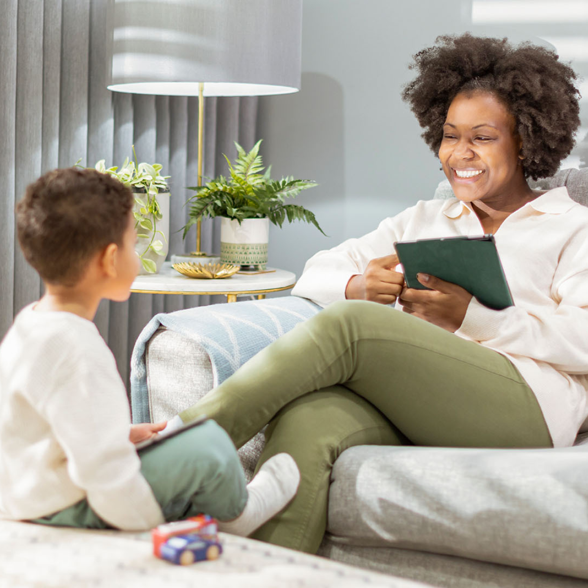 A mother and a son talking in the living room