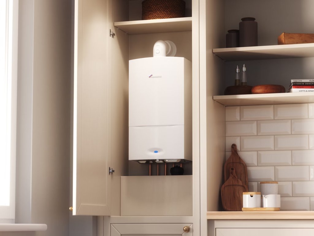 Wall‑mounted boiler fitted inside an open kitchen cupboard