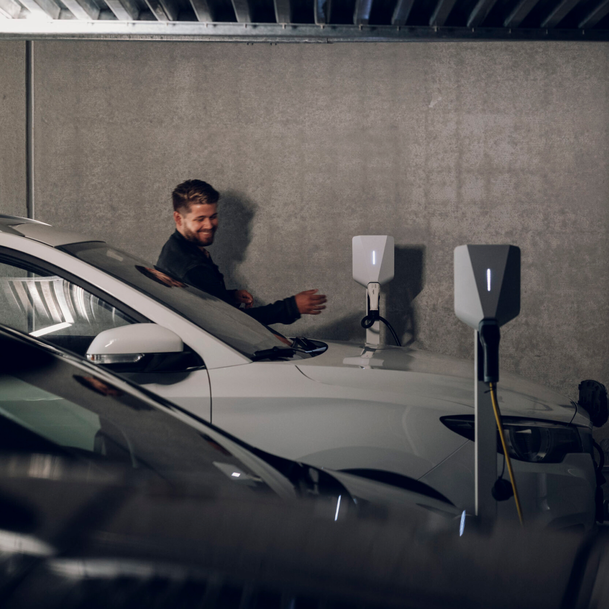 Person_about_to_plug_in_Easee_EV_charger_to_their_car