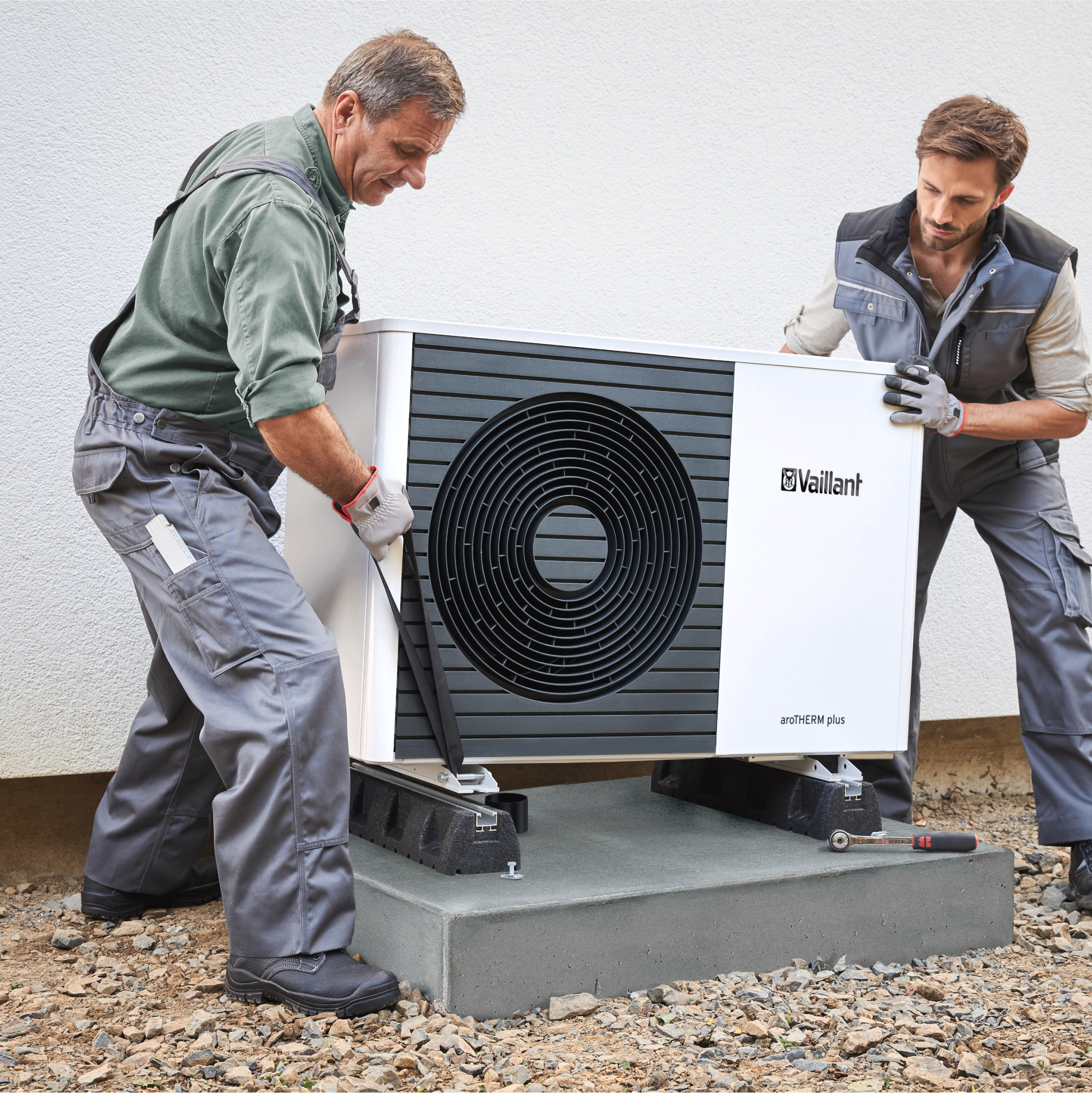 workers-installing-heat-pump