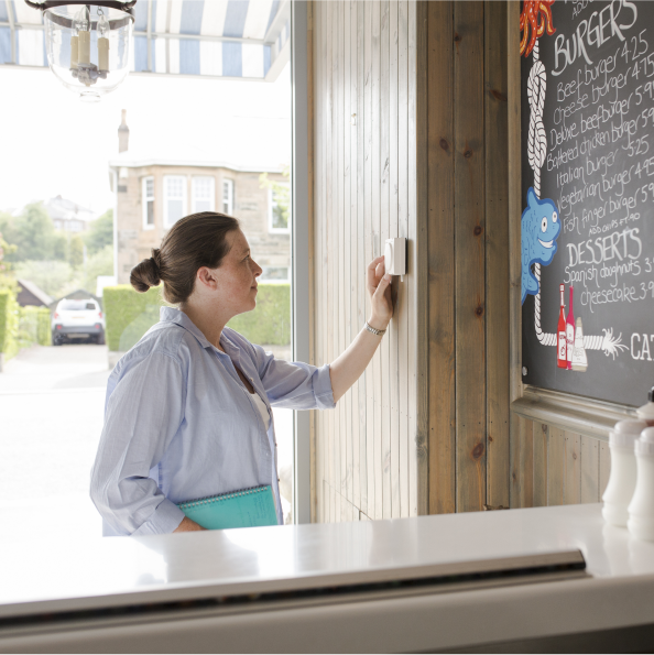 woman-in-shop-with-thermostat