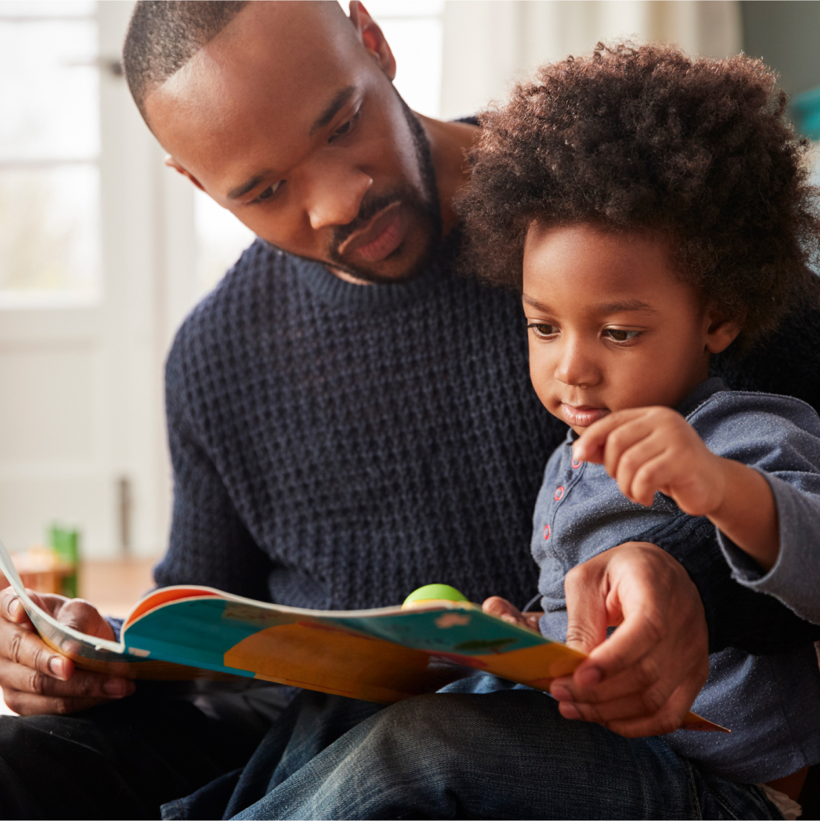 father with son reading