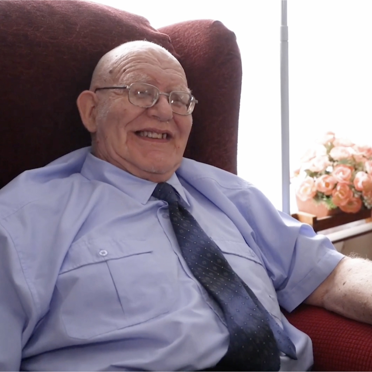 smiling person in chair