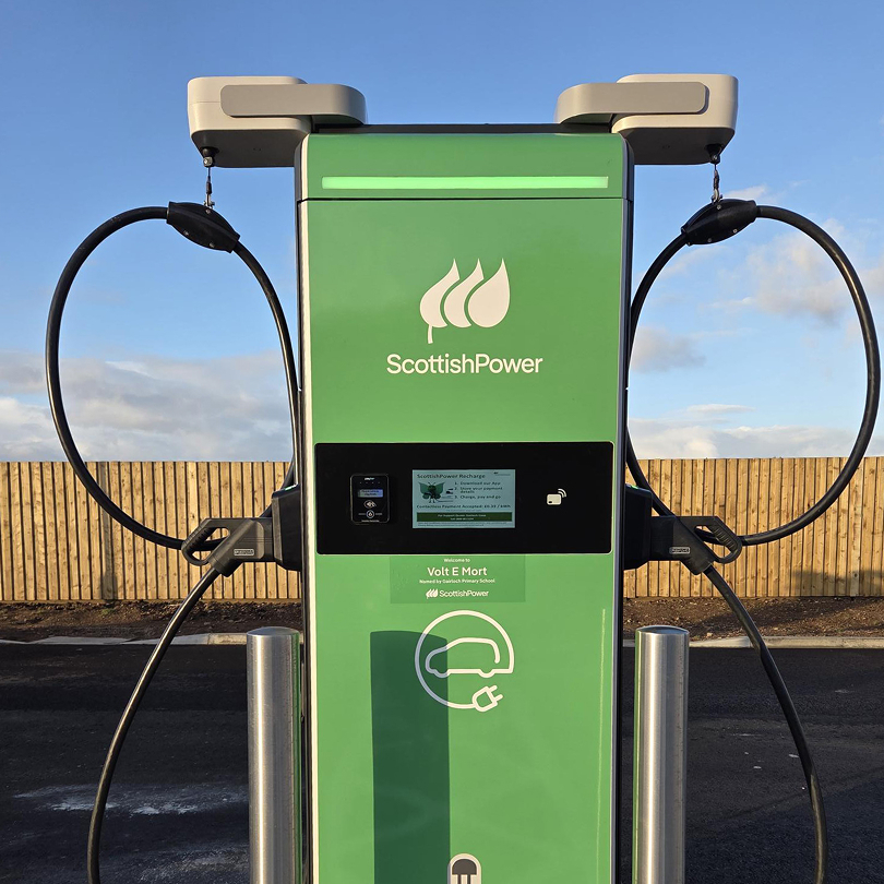 ScottishPower electric vehicle rapid charger with dual cables at a public EV charging point in Scotland.
