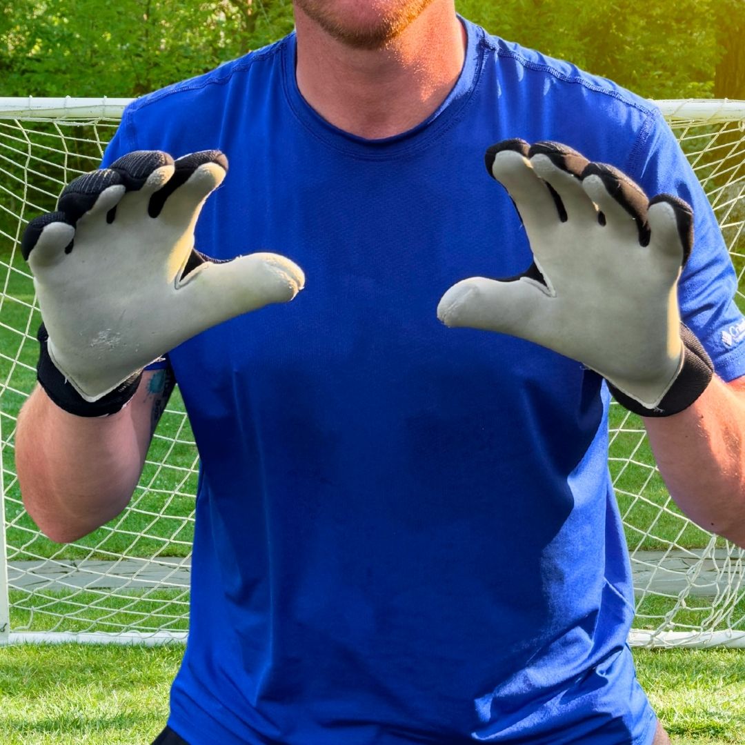 mans chest showing goalie gloves 