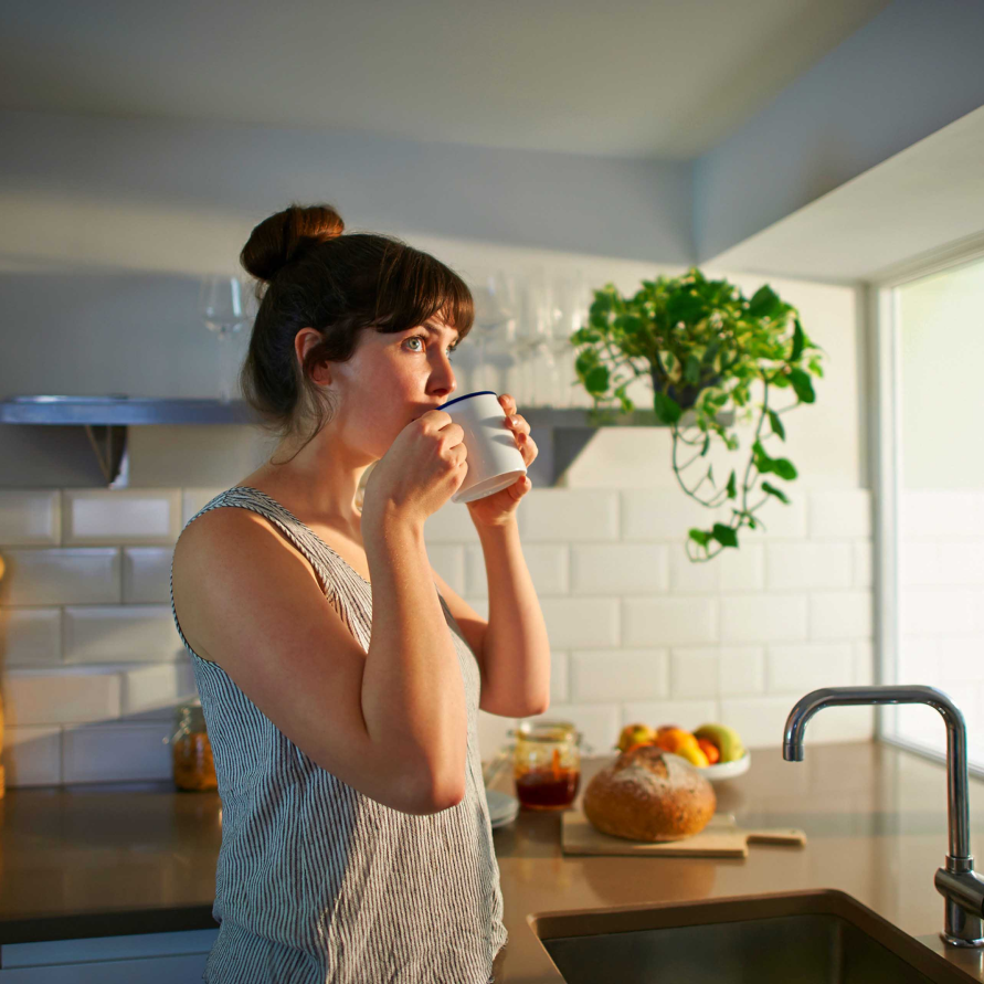 woman drinking from mug