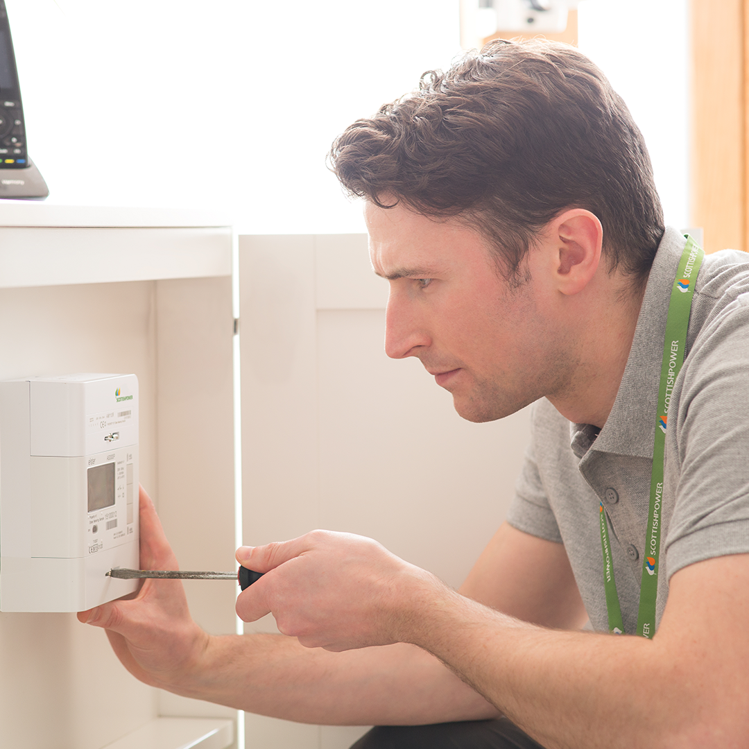 engineer fitting a smart meter