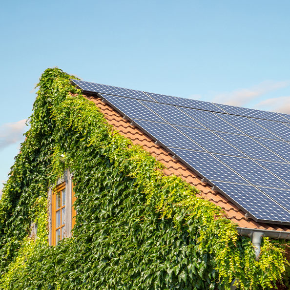 side of a house with solar panels on the roof